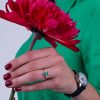 One_of_a_kind_emerald_and_diamond_engagement_ring_on_hand