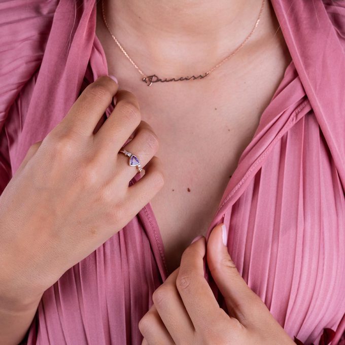 Trillion_pink_sapphire_diamond_ring_on_hand