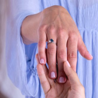 One_of_a_kind_indicolite_and_diamond_ring_on_hand