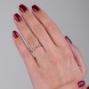 Scattered_half_eternity_diamond_ring_on_hand