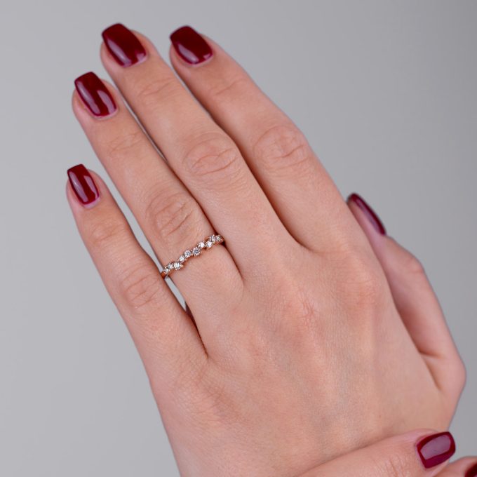 Scattered_half_eternity_diamond_ring_on_hand