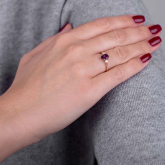 Pear_Amethyst_with_side_diamonds_engagement_ring_on_hand