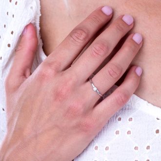 Diamond_solitaire_split_shank_engagement_ring_on_hand