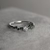 Scattered_green_diamonds_engagement_ring_detail