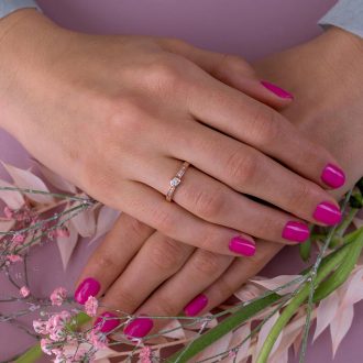 Bezel_diamond_engagement_ring_on_hand