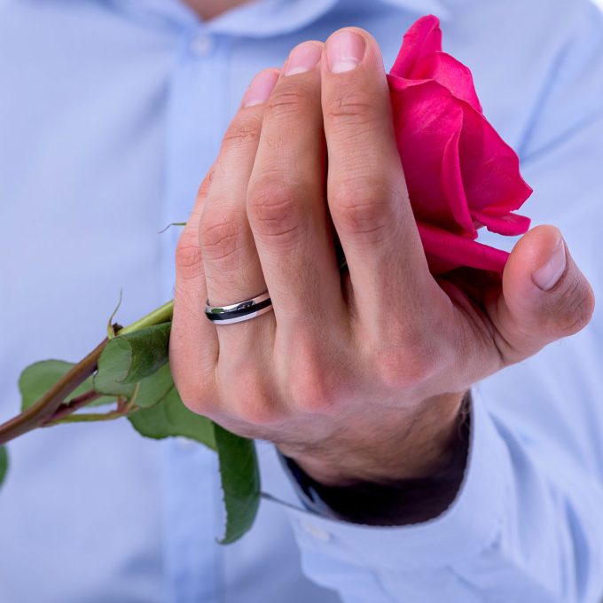 Polished_carbon_wedding_ring_on_hand