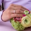 Half_eternity_channel_setting_wide_wedding_ring_on_hand