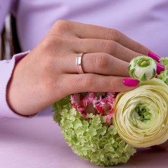 Half_eternity_channel_setting_wide_wedding_ring_on_hand
