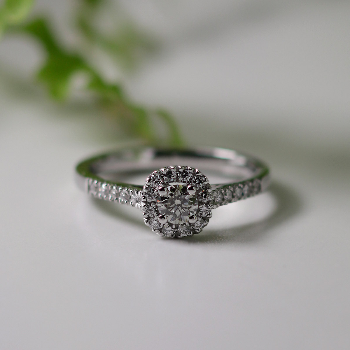 Small halo store diamond ring