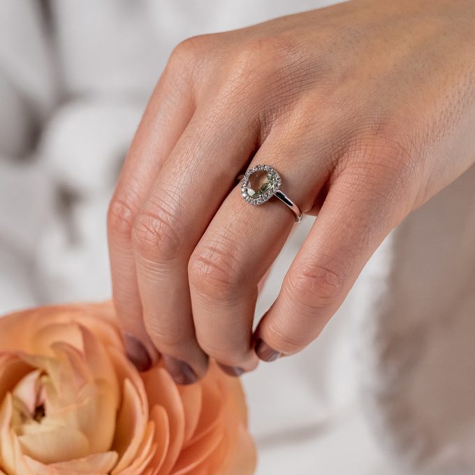 One_of_a_kind_fancy_sapphire_halo_ring_on_hand