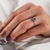 Sapphire_engagement_ring_Diamond_halo_on_hand